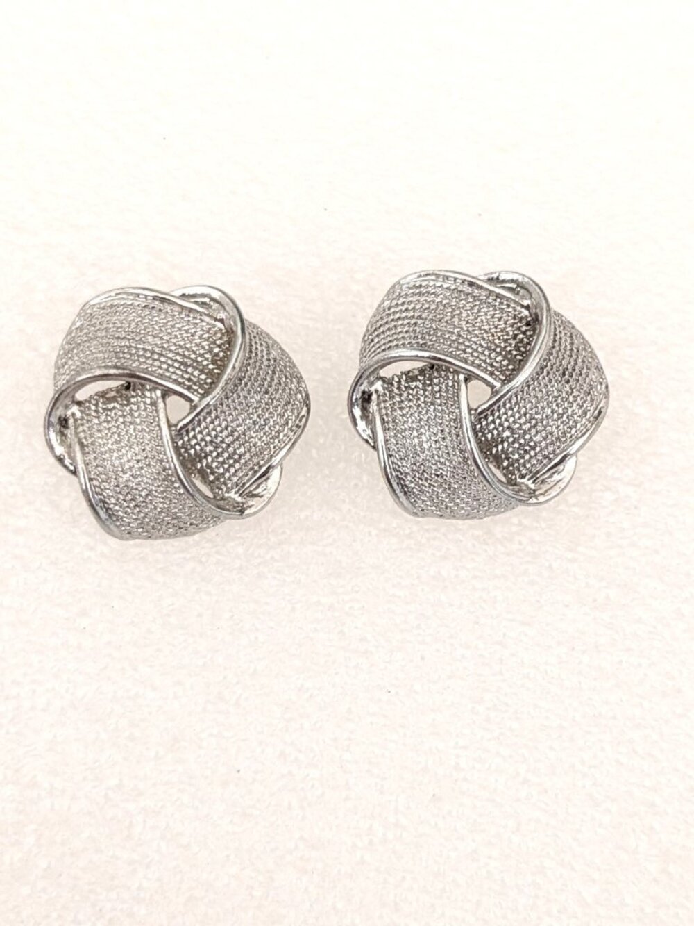 Textured post back silver tone earrings